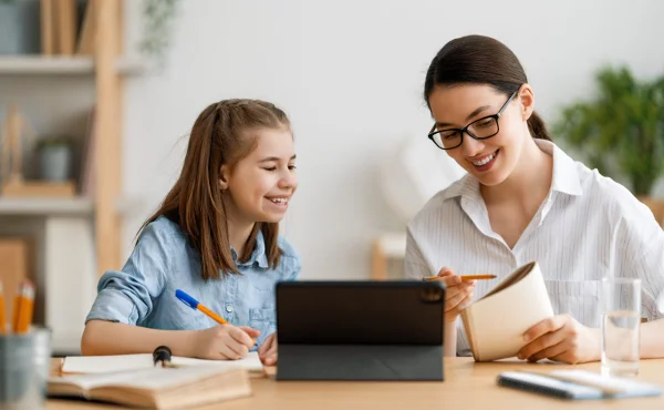 A teacherwith his doughter working on individoul study pland on a system